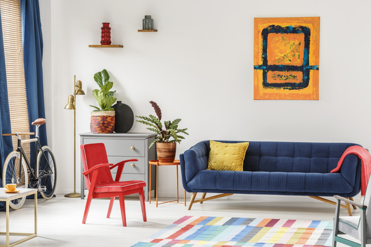 red-chair-and-royal-blue-lounge-placed-in-bright-s-2023-11-27-05-30-27-utc