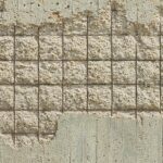 Épaufrures de béton sur un mur
